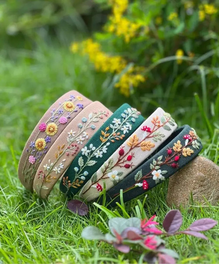 Embroidered fabric hair bands from the hair and style accessories collection, featuring floral embroidery in soft pastel tones for elegant everyday styling.